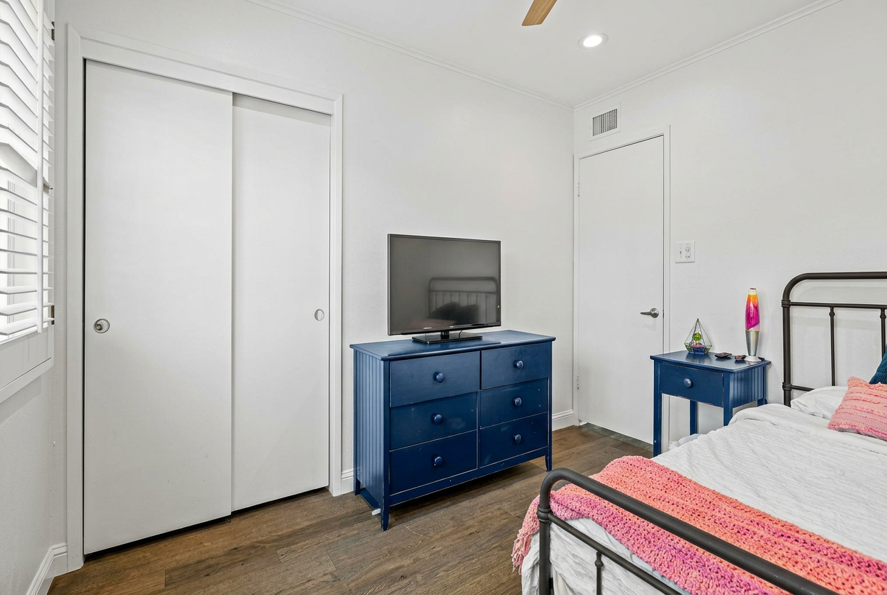 Guest bedroom with navy dresser